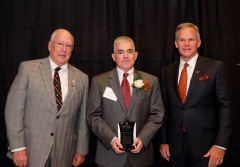 3 men with award